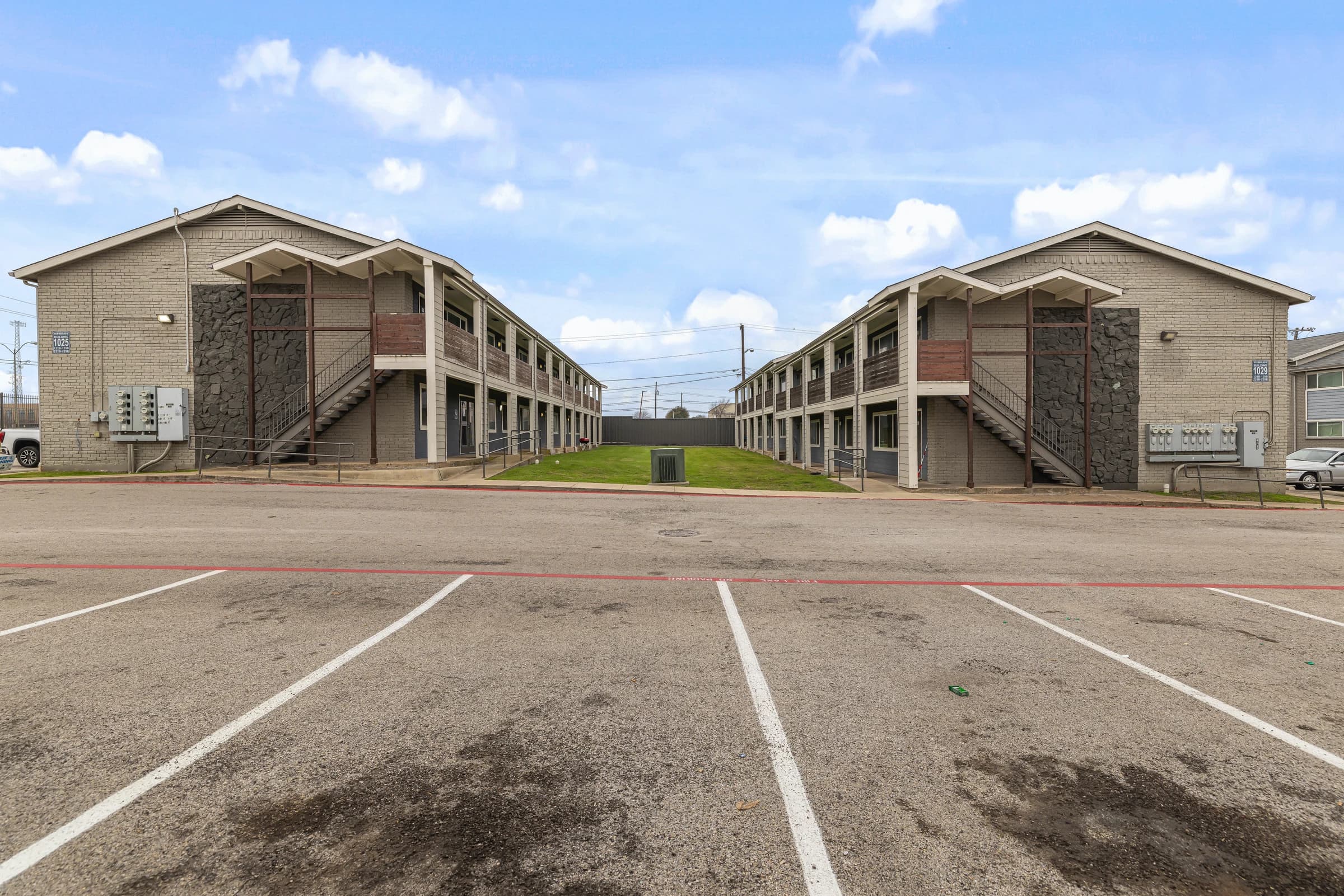 Open lawn between Waverly apartment buildings